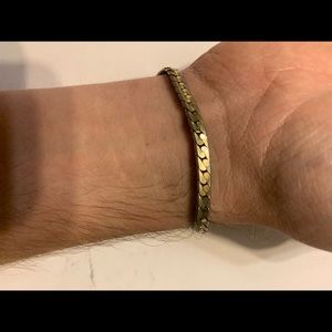 A flat Franco snake gold chain 7 inches long .